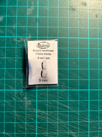 Photo of Seahorse's 8pcs 5mm Fiddle Blocks, showcasing the intricate detail and precision of the 3D printed miniature rigging components.