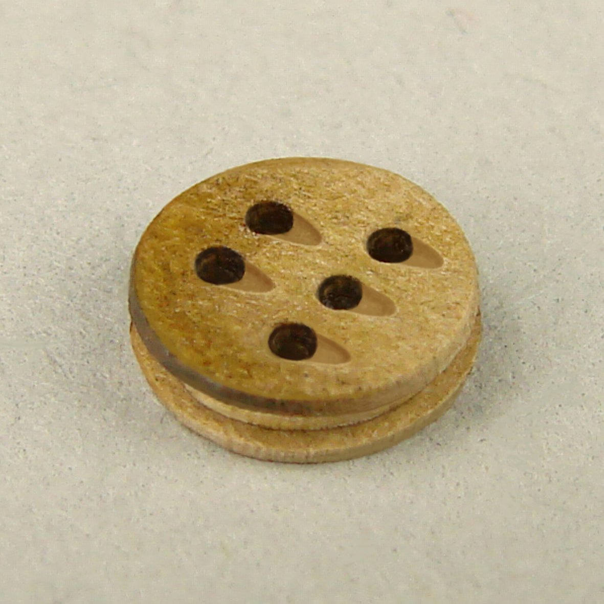 Photo of Shipyard's 5mm Deadeye Block set with 5 holes, a self-assembly rigging block kit including 10 pieces, designed for detailed model shipbuilding.
