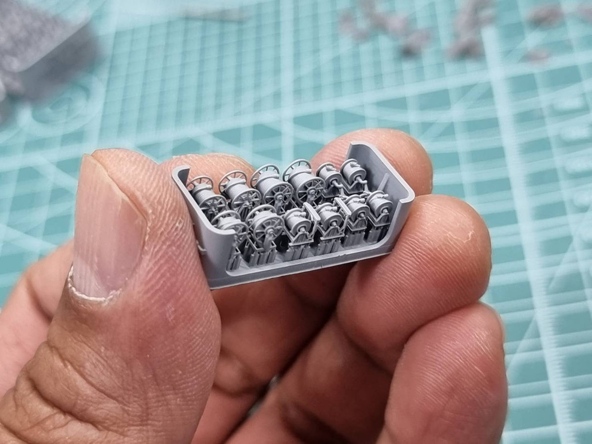 Photo of 1/350 scale 3D printed resin hose reels by HS Model showing firefighting and fuel hose reel types in five detailed variations.