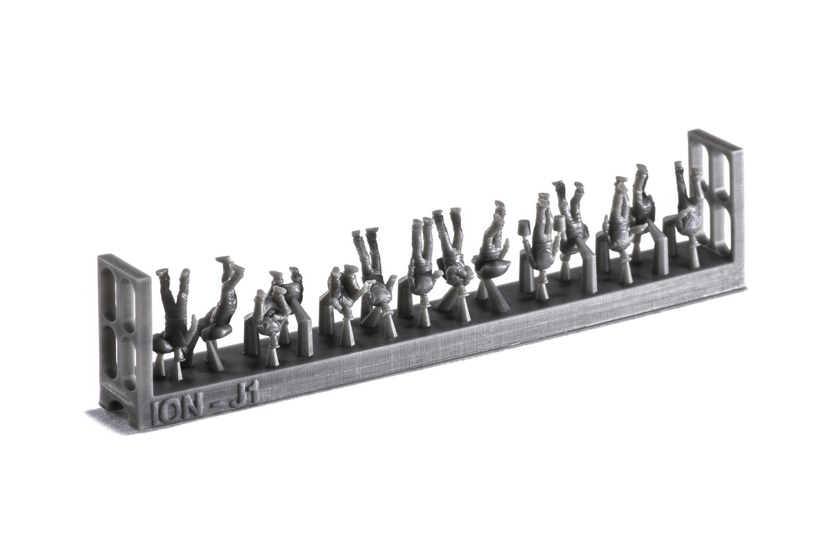 Photo of finely detailed 1:250 scale 3D-printed resin figures representing WWII Imperial Japanese Navy crew in various deck poses for model warships.