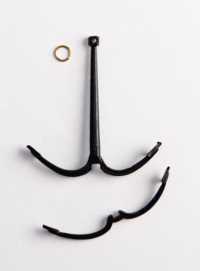 Image of Amati's 50mm Grapnel Anchor, displaying a meticulously crafted miniature replica with a traditional grapnel design, suitable for enhancing historical accuracy in model ships and nautical dioramas.