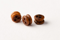 Image of Amati B4049,02 Walnut Deadeyes in 2mm, showcasing a set of 20 finely crafted miniature deadeyes made of walnut, ideal for adding intricate and authentic rigging details to scale model ships.