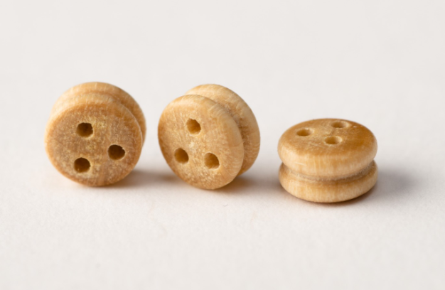 Image of Amati Boxwood Deadeyes in 5mm, showing a set of finely crafted, small wooden rigging components, essential for adding detailed and historically accurate rigging to model ships