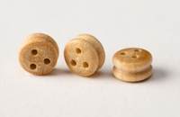 Image of Amati Boxwood Deadeyes in 5mm, showing a set of finely crafted, small wooden rigging components, essential for adding detailed and historically accurate rigging to model ships