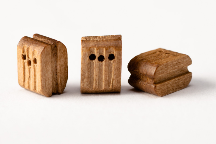 Photo of Amati B4083,07 7mm Walnut Triple Blocks, showcasing 20 intricately designed pieces for detailed and authentic rigging in model shipbuilding.