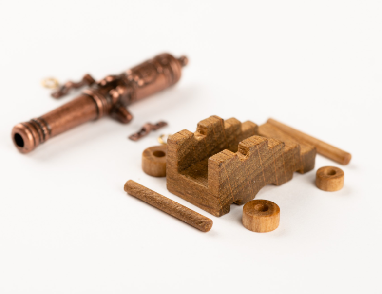 Image of Amati B4159,40 40mm Cannon with Wooden Carriage, showcasing a detailed and historically accurate miniature perfect for enhancing model ships and dioramas.