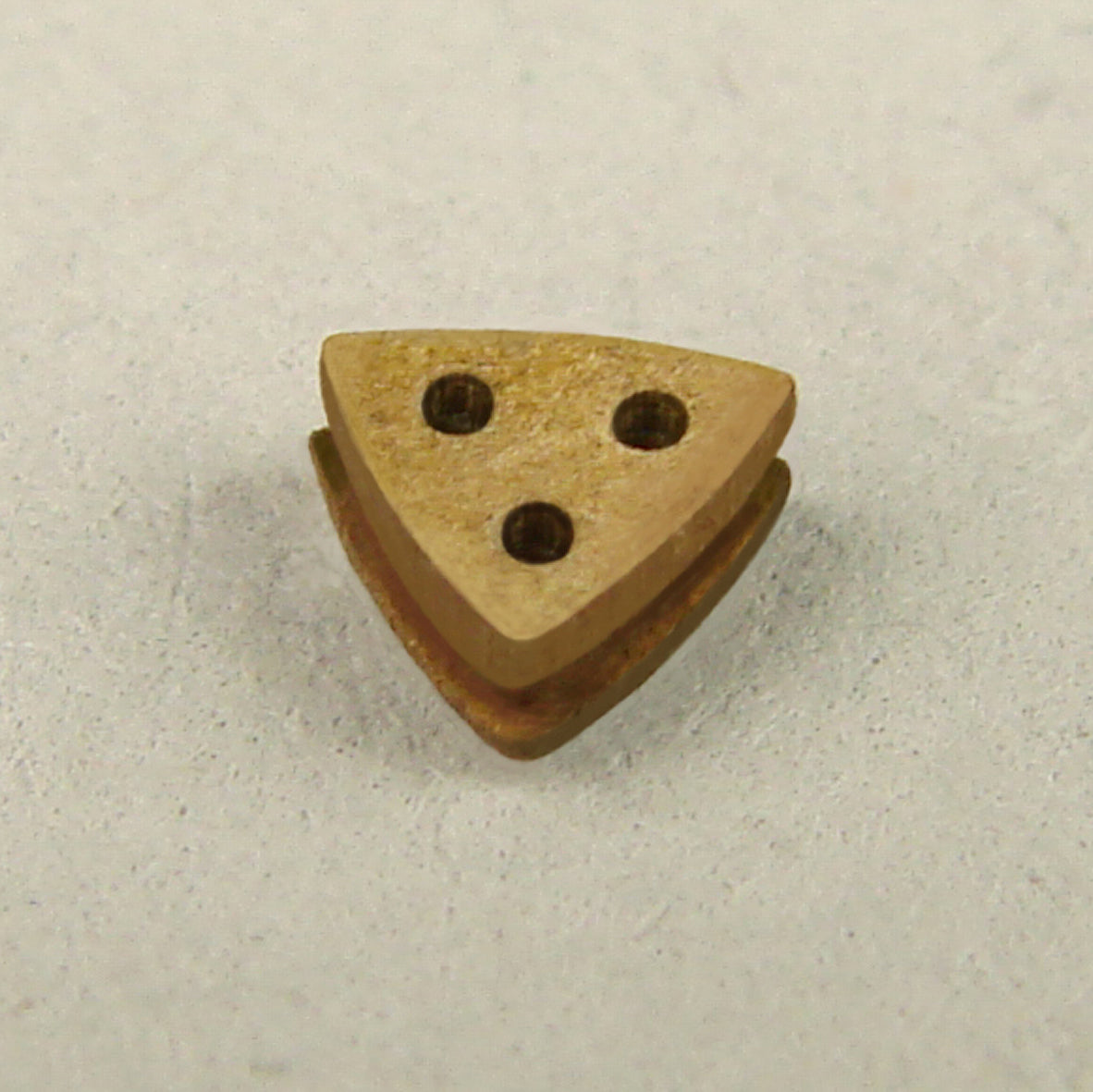 Image showcasing the Triangular Deadeye 3mm Card Rigging Blocks from Shipyard, a pack of 40, designed for detailed and authentic model ship rigging.