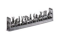 Photo of 74 finely detailed 3D-printed resin figures of US Navy WWII personnel in 1:250 scale, posed in active and relaxed positions for ship modeling.