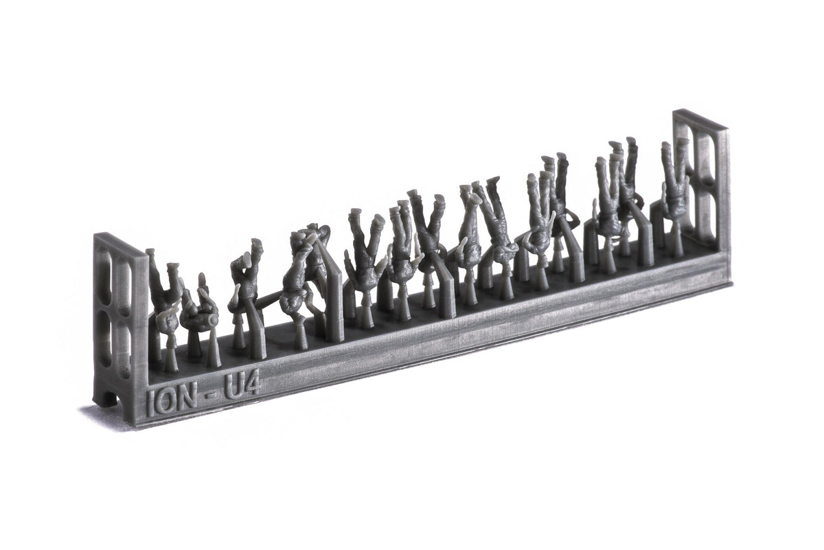 Photo of 74 finely detailed 3D-printed resin figures of US Navy WWII personnel in 1:250 scale, posed in active and relaxed positions for ship modeling.