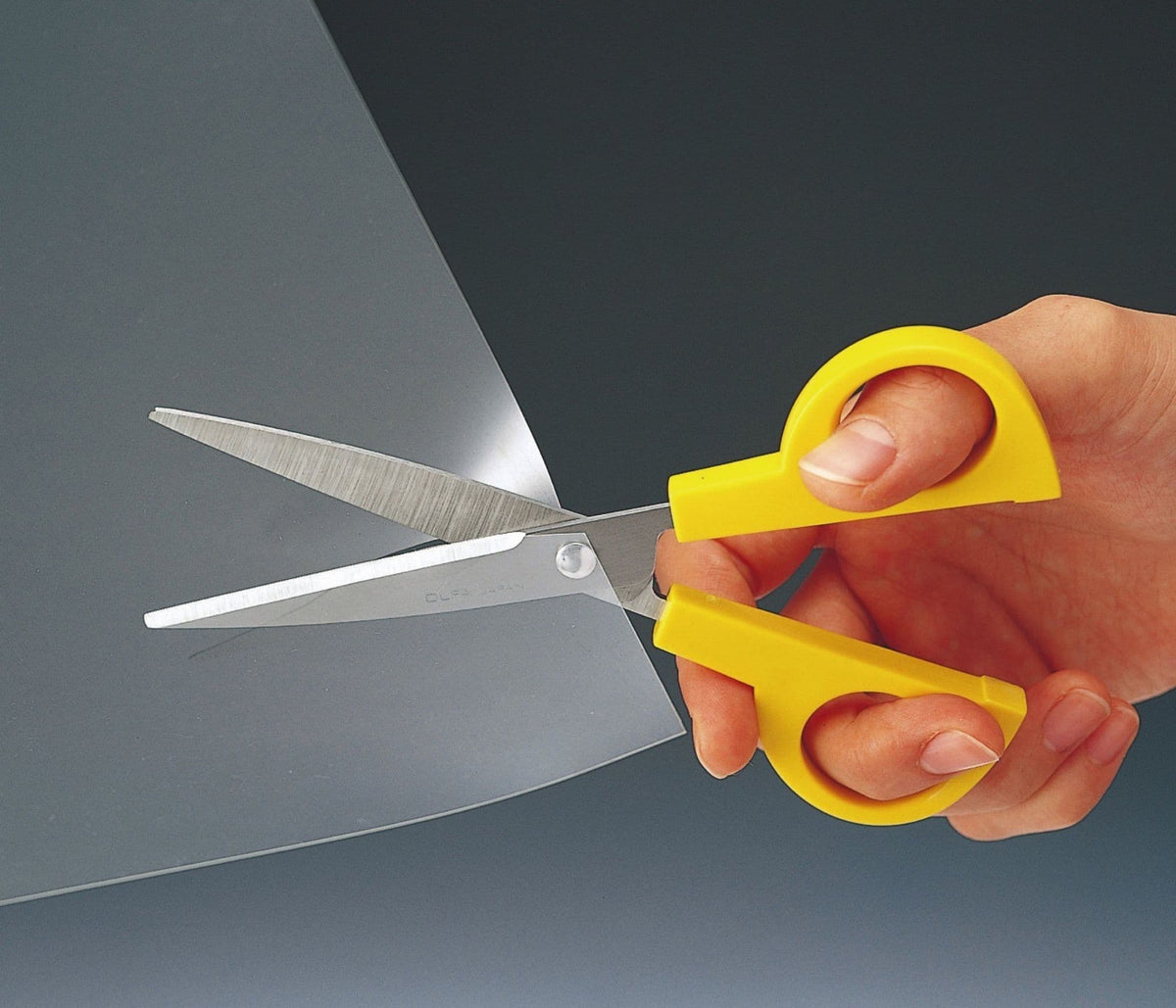 Photo of Classic Scissors OLFA (OLF/SCS3) with stainless steel serrated blades, designed for precise cutting of paper, fabric, and more.