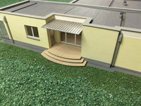 Photo of Opal Single-Family House 1:87 scale laser-cut card model kit by Vessel Railway Miniatures for HO scale railway dioramas