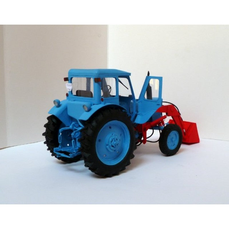 A blue and red tractor model with a front loader attachment, photographed on a plain light background.