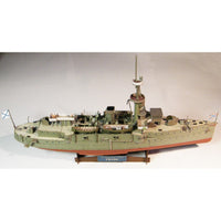 A detailed model of the historical battleship HMS T-ANK, displayed on a wooden stand against a neutral light gray background.
