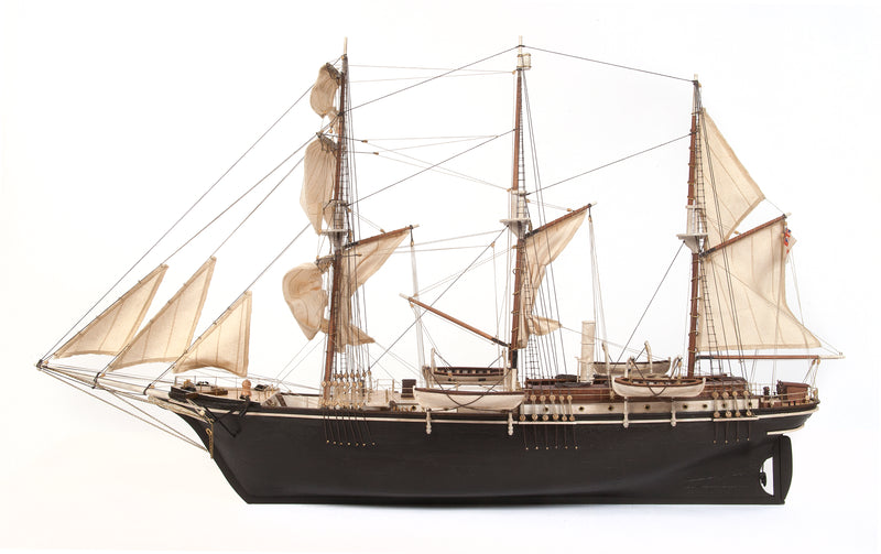 Photo of OcCre Endurance 1:70 wooden model ship kit with sails, nameplate, and detailed wooden construction