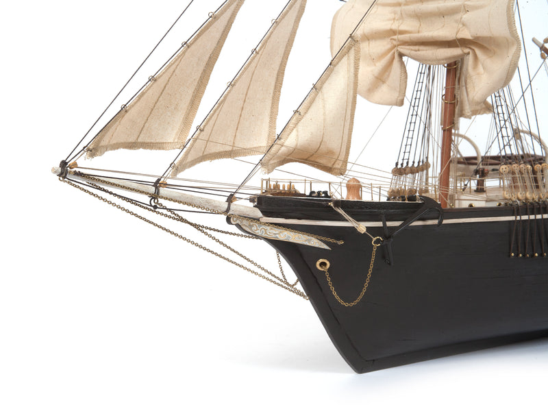 Photo of OcCre Endurance 1:70 wooden model ship kit with sails, nameplate, and detailed wooden construction