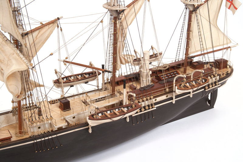 Photo of OcCre Endurance 1:70 wooden model ship kit with sails, nameplate, and detailed wooden construction