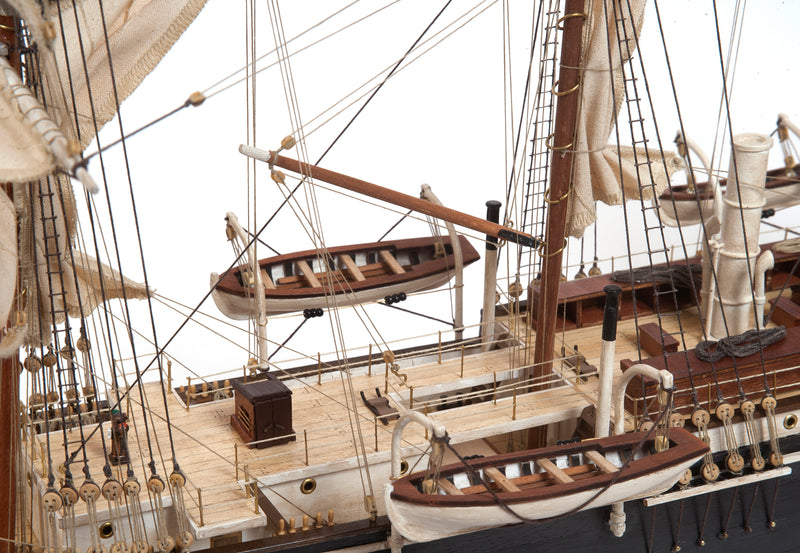Photo of OcCre Endurance 1:70 wooden model ship kit with sails, nameplate, and detailed wooden construction
