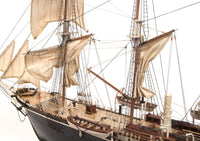 Photo of OcCre Endurance 1:70 wooden model ship kit with sails, nameplate, and detailed wooden construction