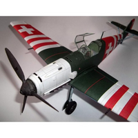 A model Swiss Air Force fighter plane, likely a Fieseler Fi 156, featuring a dark green fuselage, white nose cowling, and red-and-white striped wings with white Swiss crosses.