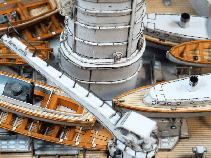 Photo of HMV S.M.S. Nassau paper model kit 1/250 scale battleship card model with detailed hull, turrets, and display stand