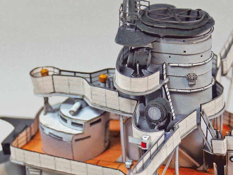 Photo of HMV S.M.S. Nassau paper model kit 1/250 scale battleship card model with detailed hull, turrets, and display stand