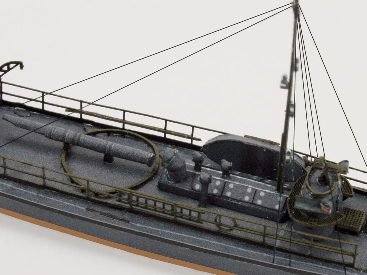 Photo of HMV Harbor Torpedo Boat S33–S35 card model kit in 1/250 scale with detailed paper parts and diorama pier.