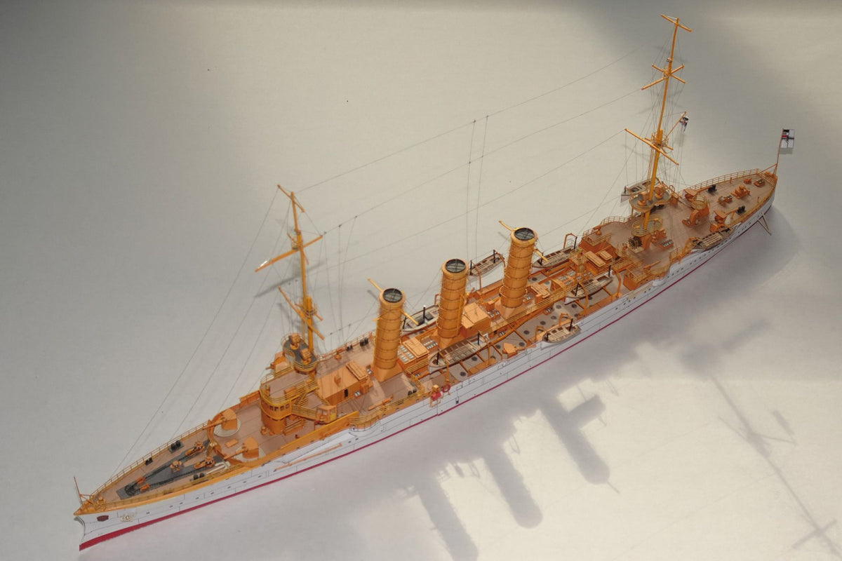 Photo of HMV SMS Emden 1/250 paper model kit – German light cruiser card model with detailed hull, bridge interior, and filigree masts.