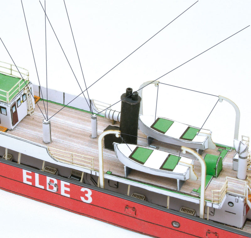Photo of HMV Light Vessel Elbe 3 Card Model Kit 1/250 showing detailed red hull, weathered deck, and filigree stern design