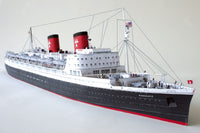 Photo of HMV TS Hanseatic 1/250 card model kit showing detailed superstructure, lifeboats, and elegant hull design by Peter Brandt