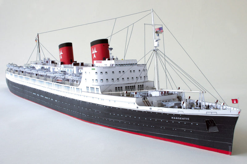 Photo of HMV TS Hanseatic 1/250 card model kit showing detailed superstructure, lifeboats, and elegant hull design by Peter Brandt