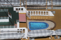 Photo of HMV TS Hanseatic 1/250 card model kit showing detailed superstructure, lifeboats, and elegant hull design by Peter Brandt