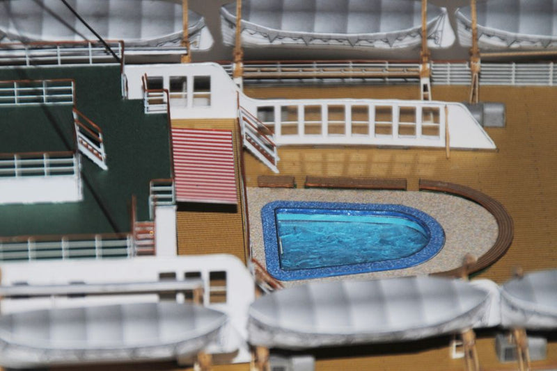 Photo of HMV TS Hanseatic 1/250 card model kit showing detailed superstructure, lifeboats, and elegant hull design by Peter Brandt