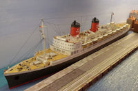 Photo of HMV TS Hanseatic 1/250 card model kit showing detailed superstructure, lifeboats, and elegant hull design by Peter Brandt