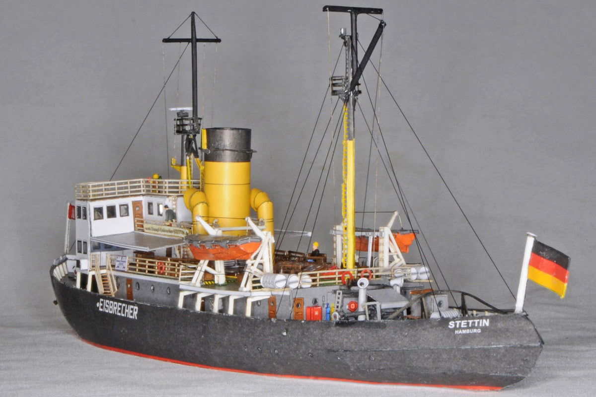 Photo of HMV Steam Icebreaker STETTIN card model kit 1:250 showing detailed paper model of the German museum ship with masts, rigging, and bridge interior