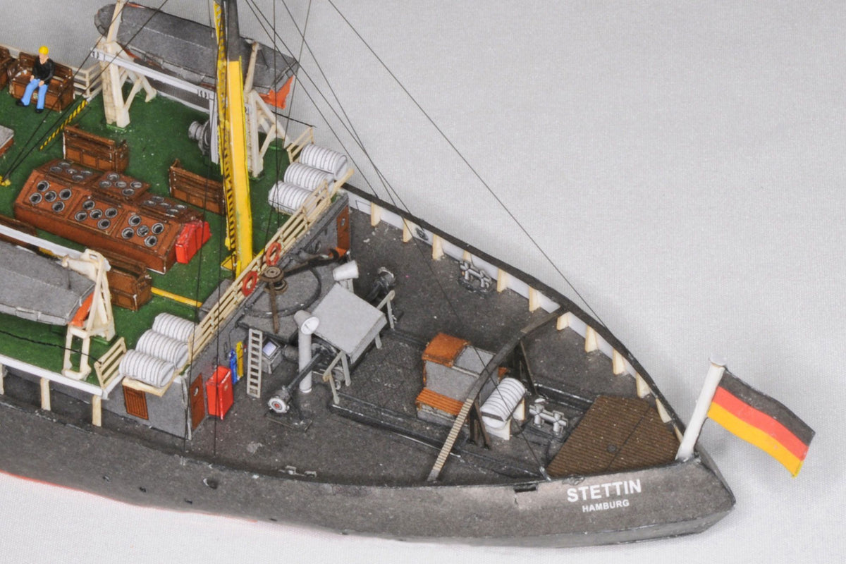Photo of HMV Steam Icebreaker STETTIN card model kit 1:250 showing detailed paper model of the German museum ship with masts, rigging, and bridge interior