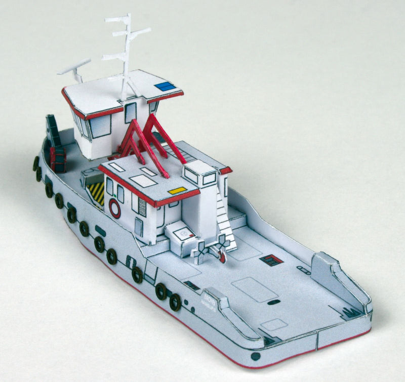 Photo of HMV Modern Harbor Boats 1/250 card model kit showing eight detailed paper ships including customs boats, tugboat, pilot cutters, and police boats.