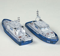 Photo of HMV Modern Harbor Boats 1/250 card model kit showing eight detailed paper ships including customs boats, tugboat, pilot cutters, and police boats.