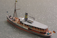 Photo of HMV Passenger Steamer Alexandra 1/250 card model kit showing detailed decks, lifeboat, and superstructure.