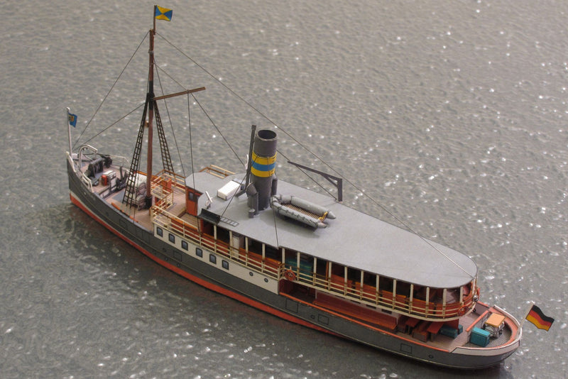 Photo of HMV Passenger Steamer Alexandra 1/250 card model kit showing detailed decks, lifeboat, and superstructure.