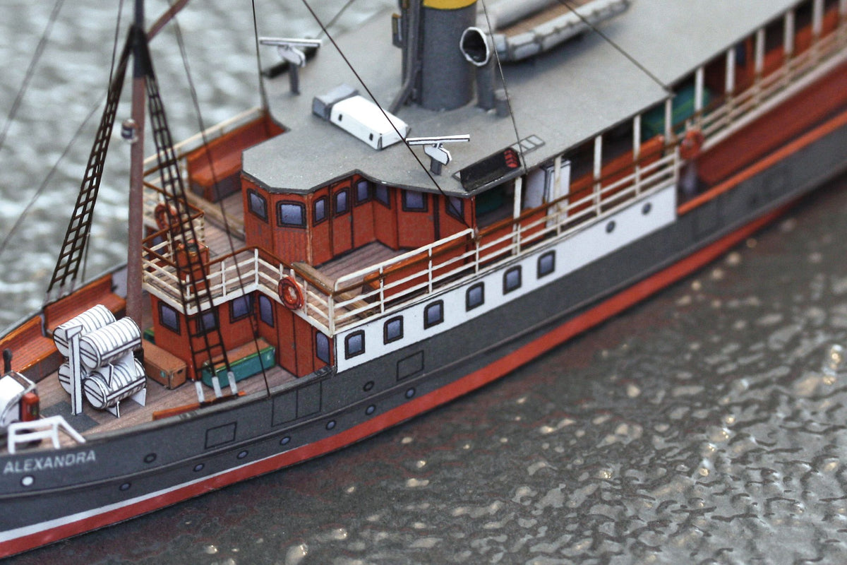 Photo of HMV Passenger Steamer Alexandra 1/250 card model kit showing detailed decks, lifeboat, and superstructure.
