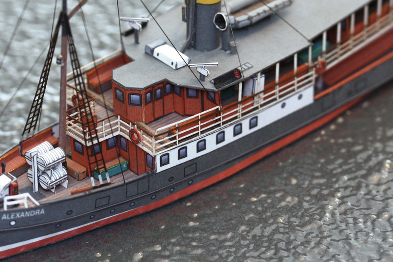 Photo of HMV Passenger Steamer Alexandra 1/250 card model kit showing detailed decks, lifeboat, and superstructure.
