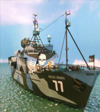A detailed model of a pirate ship named 'Steve Irwin' with the number 17, featuring a black and gray camouflage pattern, a skull and crossbones emblem, and a Jolly Roger flag, set against a simulated ocean and sky background.