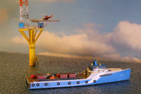 Photo of HMV Fast Crew Supplier Doña Diana 1:250 paper model ship kit designed by Till Schade, featuring blue Axe-Bow hull and deck cargo.
