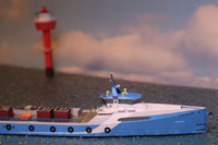 Photo of HMV Fast Crew Supplier Doña Diana 1:250 paper model ship kit designed by Till Schade, featuring blue Axe-Bow hull and deck cargo.