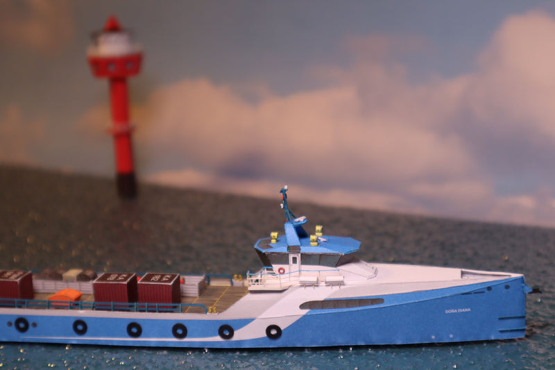 Photo of HMV Fast Crew Supplier Doña Diana 1:250 paper model ship kit designed by Till Schade, featuring blue Axe-Bow hull and deck cargo.