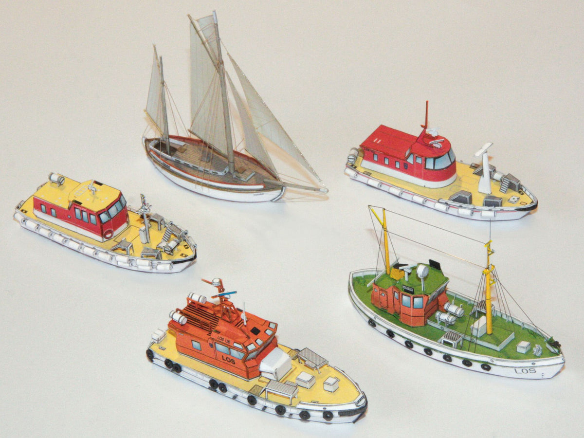 Photo of HMV Norwegian Pilot Boat Card Model Kit 1/250 (103340) featuring six detailed Norwegian pilot boats and a Colin Archer cutter from different eras.