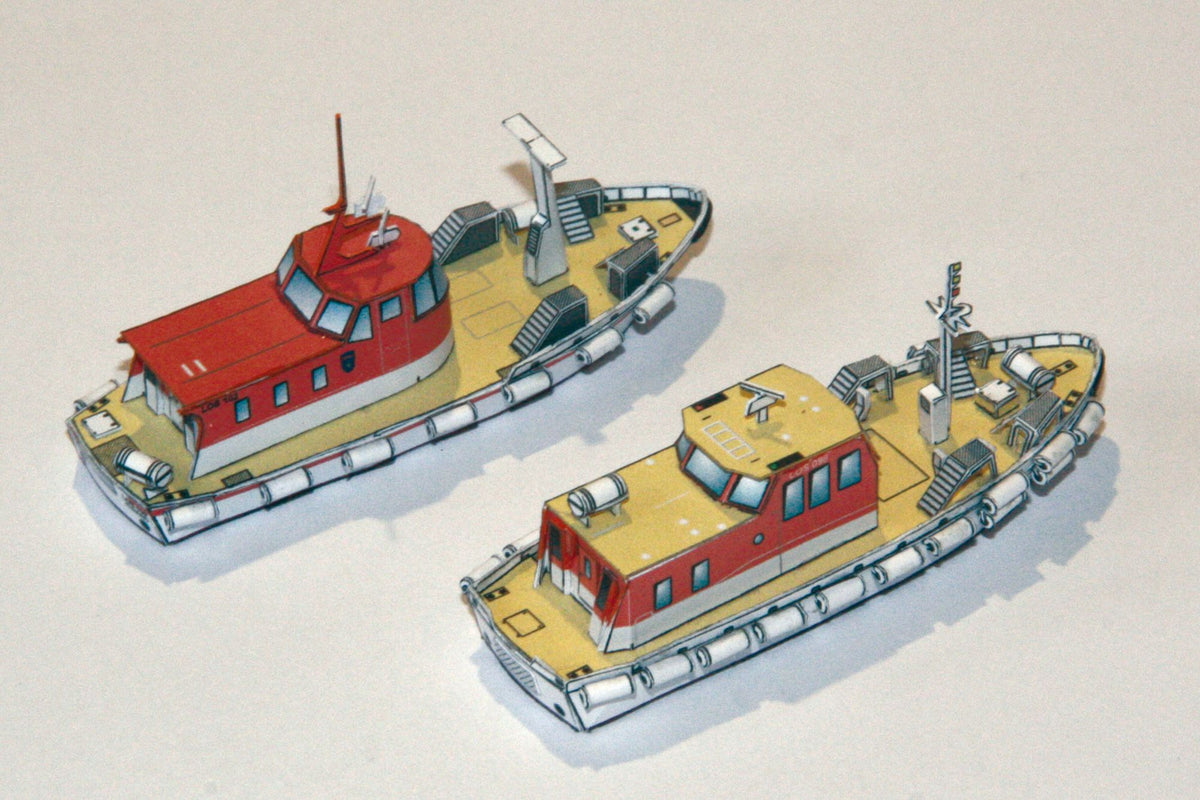 Photo of HMV Norwegian Pilot Boat Card Model Kit 1/250 (103340) featuring six detailed Norwegian pilot boats and a Colin Archer cutter from different eras.