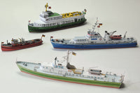Photo of HMV Hamburg Museum Ships Card Model Kit 103342 showing four detailed paper ship models – Feuerwehr IV, Kirchdorf, Glückstadt, and Elbe 1 – in 1/250 scale