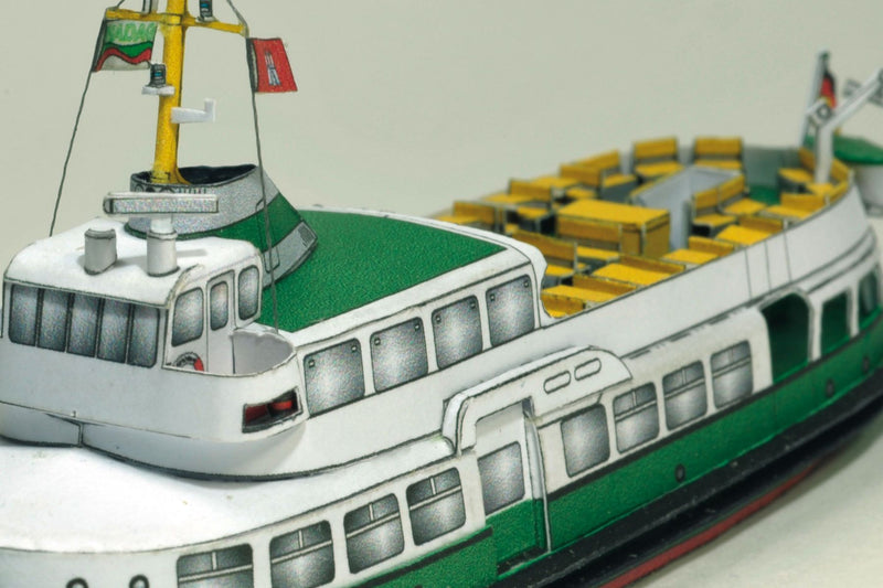 Photo of HMV Hamburg Museum Ships Card Model Kit 103342 showing four detailed paper ship models – Feuerwehr IV, Kirchdorf, Glückstadt, and Elbe 1 – in 1/250 scale