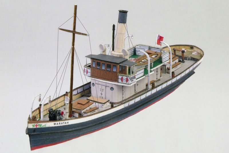 Photo of the HMV 1/250 scale Steam Tug Waratah paper model kit showing detailed deck design, filigree masts, and bridge interior.